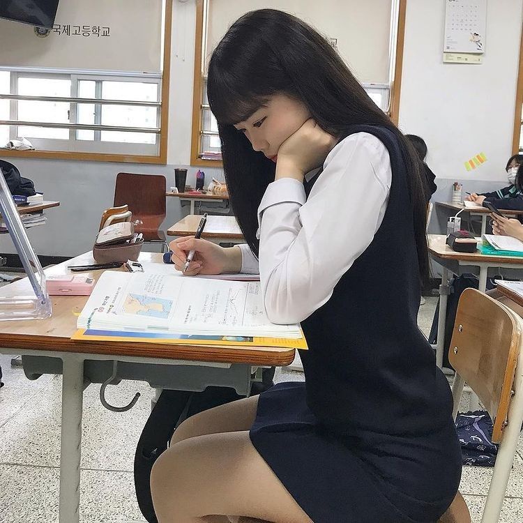 female student studying in classroom